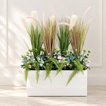 Bồn cỏ lau giả nhiều màu có kết hợp cỏ và hoa cúc hoạ mi